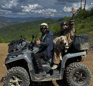 a man and a woman riding on a quad
