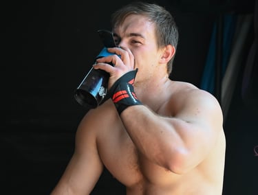 Athlete drinking his intra-workout shake during training