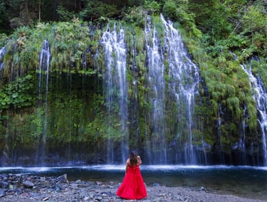 california, waterfalls, mossbrae falls, a woman in a red dress standing in front of a waterfall