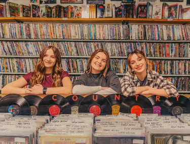 Senior pictures in a record store by Manheim PA senior picture photographer. Senior Rep Team Lancaster PA