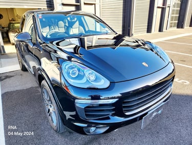 Glossy black Porsche Cayenne luxury SUV ceramic coating applied by The Coating Lab
