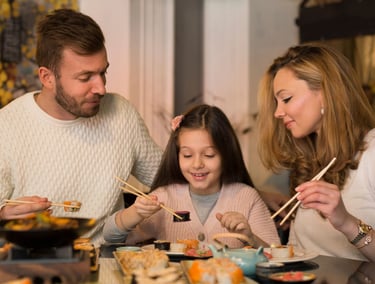 Family eating Sushi