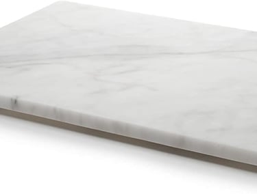 a marbled cutting board with a marbled surface
