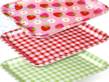 three plates with strawberries and strawberries on them