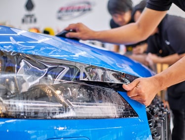 a man is working on a car in a garage