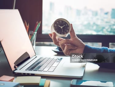 a man holding a clock in hand