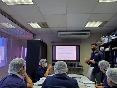 a group of people sitting around a table