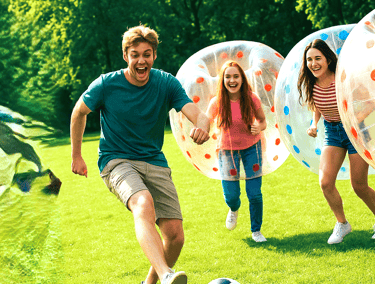 a group of people playing soccer in a fieldMPERBALL IN GREENVILLE
