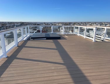 Custom framed floating rooftop decking over top of fiberglass.