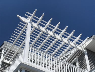 Vinyl pergola system integrated into deck railing