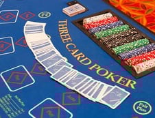 Three Card Poker table with blue felt