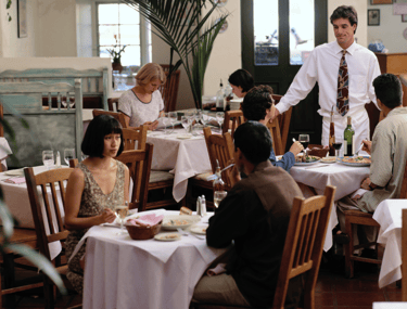 People sitting in a restaurant to connote restaurant AI