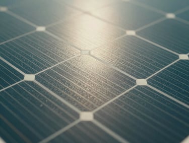 Close-up macro shot of solar cells highlighting the crystalline texture and light reflection in sage and teal tones.