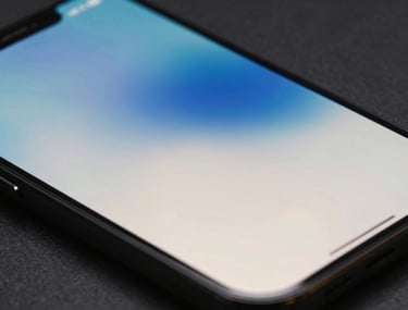 Abstract photography of light reflecting off a glass smartphone screen, creating a blue and off-white flare. Modern, artistic, International / European tech style.