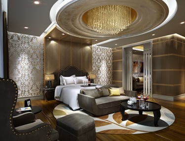 Luxury master bedroom interior with a grand crystal chandelier, damask wallpaper, and velvet seating.