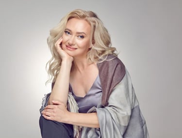 a sugar mommy in a gray dress and a scarf