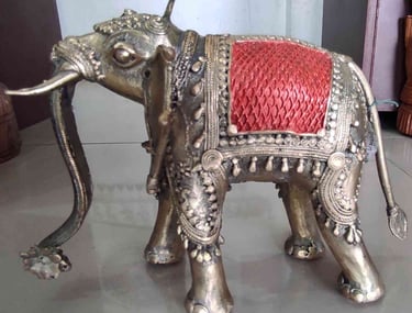 Artisan-made tribal brass elephant featuring red-painted design on the back-Meant for export