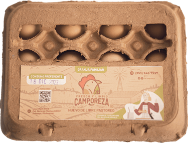 a carton of eggshells with a card attached to it