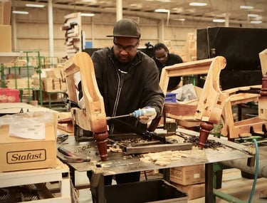 Man working on furniture part with machines built by national pneumatic systems in vasai .