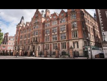 a large building with a clock tower in the middle of it
