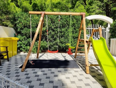 The photo shows the children's swing from another angle.