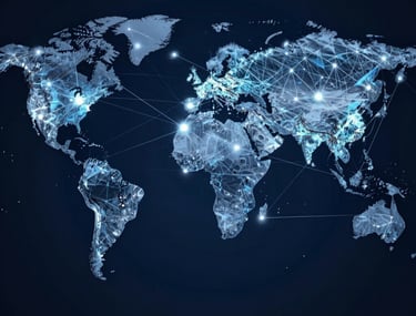 An abstract image showing a network of light, symbolizing global connectivity and digital innovation. Dark navy and steel blue colors.