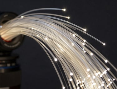Hyper-detailed photography of a glowing fiber-optic cable network, symbolizing high-speed tech news and data flow.