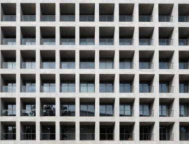 Minimalist architectural photography of a modern building facade in France, emphasizing symmetry and professional clarity.