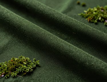 Extreme close-up of high-quality sustainable fabric or industrial mesh, dark moss green color, cinematic depth of field, sophisticated lighting.