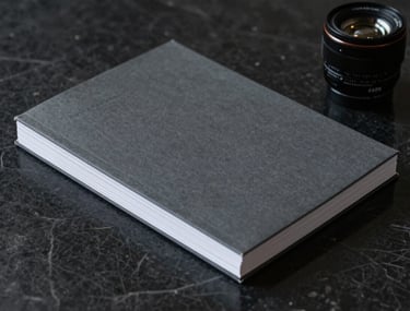 Minimalist composition showing a stack of high-end dark grey business reports on a black marble surface, professional consultant's workspace vibe.