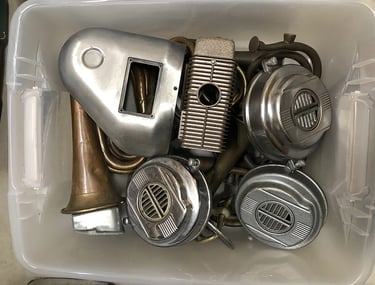 Metal parts in a sculptor's workshop bin, image 12.