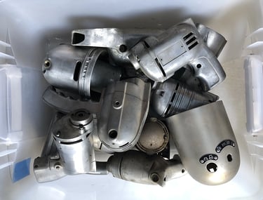 Metal parts in a sculptor's workshop bin, image 9.