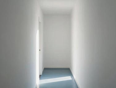 Clean photo of a white hallway with perfectly smooth drywall surfaces. Minimalist aesthetic, steel blue floor, soft morning light in a Brazilian apartment.