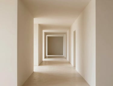 Perspective view of a long hallway with rhythmic drywall niches. Professional lighting, minimalist style, cream and tan color palette.
