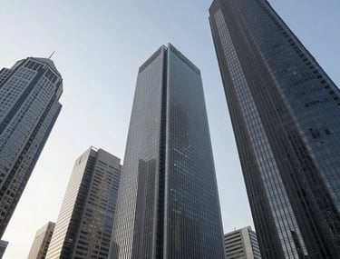 Perspective shot looking up at several sleek, graphite grey skyscrapers in a modern South American business district, captured during a clear day.