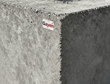 Close-up photography of finished structural concrete showing the fine aggregate and quartz sand blend provided by Gayen Construction.