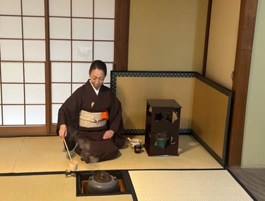 Tea ceremony master whisking matcha during a traditional tea ceremony
