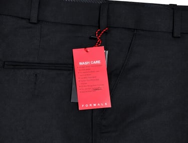 a black suit with a red tag  on it