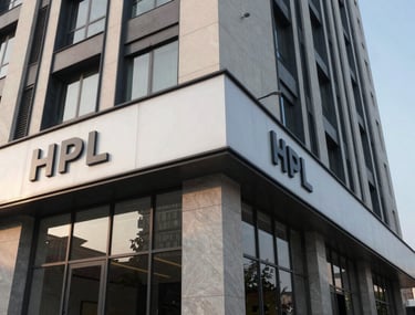 Exterior architectural shot of a modern commercial building in Faridabad featuring professional HPL work and clean structural lines.