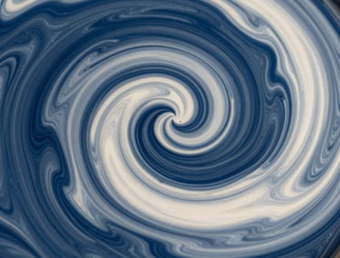 High-speed photography of metallic paint swirling in deep blue and off-white, capturing fluid movement and sharp detail, modern and clean, North American / US.