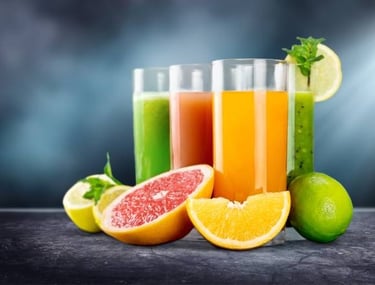 a group of three glasses of juices with fruits and vegetables