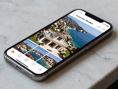 Close-up of a high-end smartphone on a marble surface showing a professional Instagram grid of a luxury villa in Bodrum. Elegant lighting, professional content creation style. Turkish / Aegean Coast.