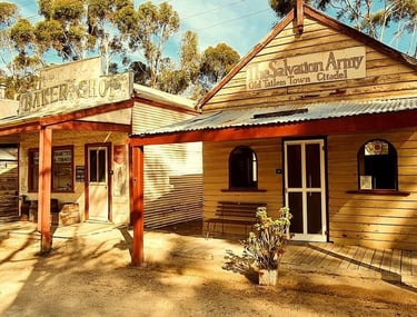 Historic wooden buildings including a baker shop and Salvation Army citadel at Old Tailem Town pioneer village.