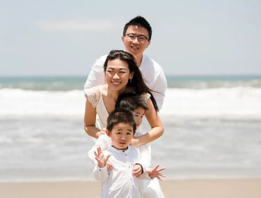 Natural family portrait during a relaxed beach session in Seminyak Bali