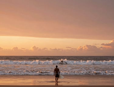 Wide shot of a Brazilian beach at dawn with a single surfer walking towards the water. The sky is a gradient of terracotta and sand colors. Cinematic photography.