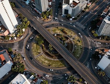 Overhead photography of a complex roundabout design in a South American city, showcasing geometric precision and urban integration.