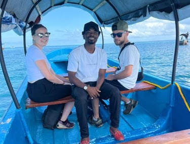 A smiling guest with a local guide en route to Prison Island. Friendly and knowledgeable guides on every tour.