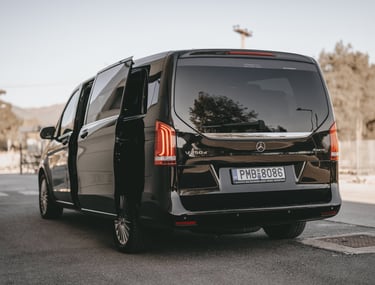 ide view of black Mercedes V-Class with open door for easy passenger boarding