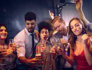 Group of friends partying with drinks during a Fremont Club Crawl in Downtown Las Vegas