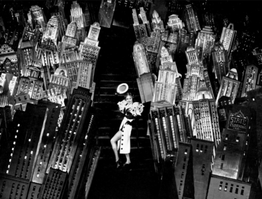 Ruby Keeler with glowing New York skyline cutouts – 42nd Street finale magic